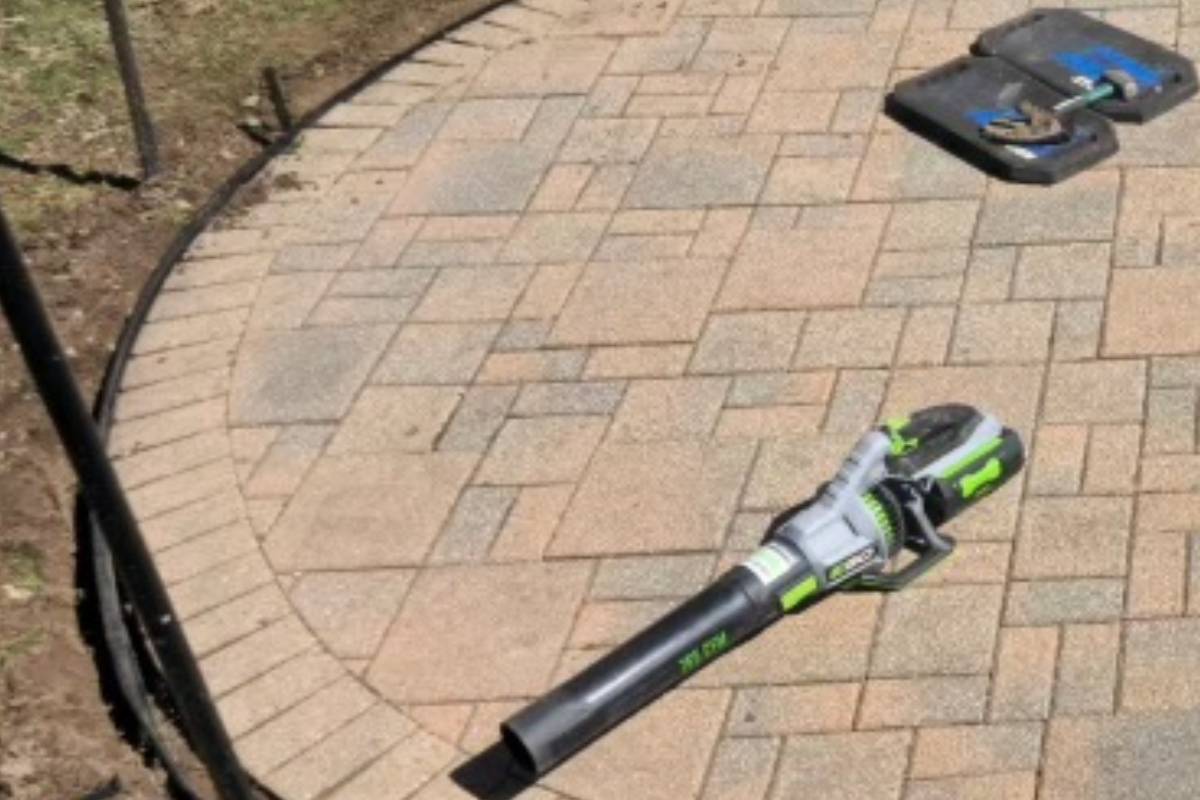 cleaning a rounded stone patio