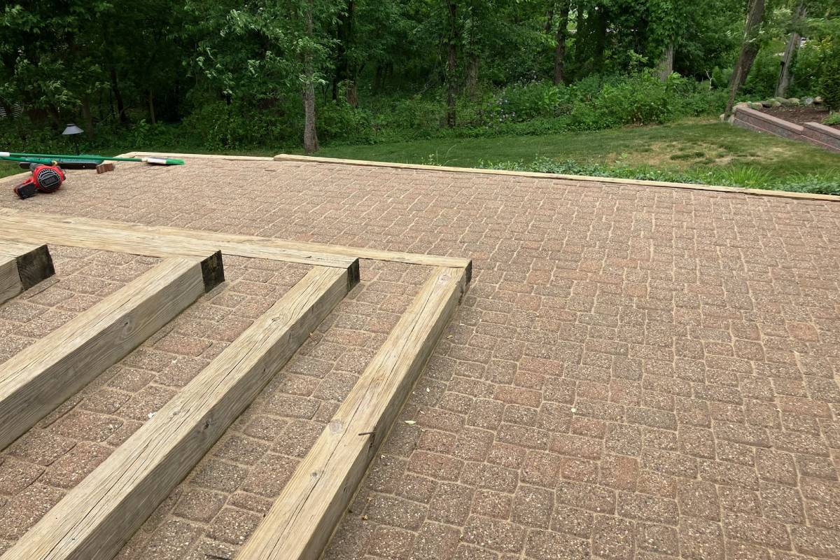 finished stone brick patio with steps in Michigan backyard